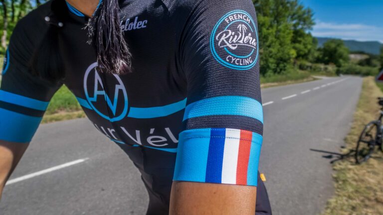 A French Flag With Logo Patch on a Cycling Track