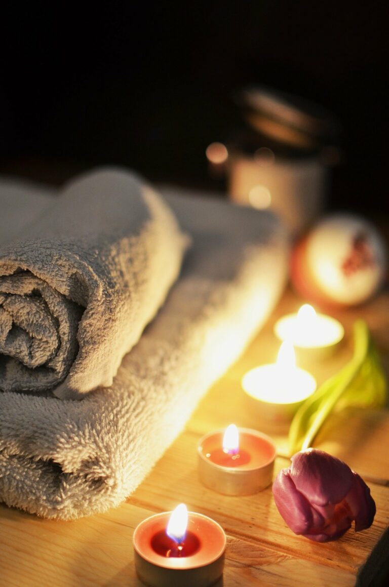 A Balled Towel With Tea Candles