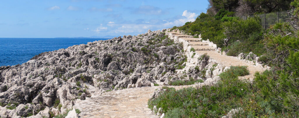 Stone path along rocky seaside cliffs