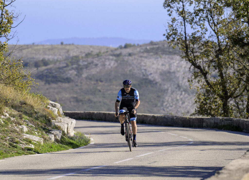 Cyclist riding on winding mountain road