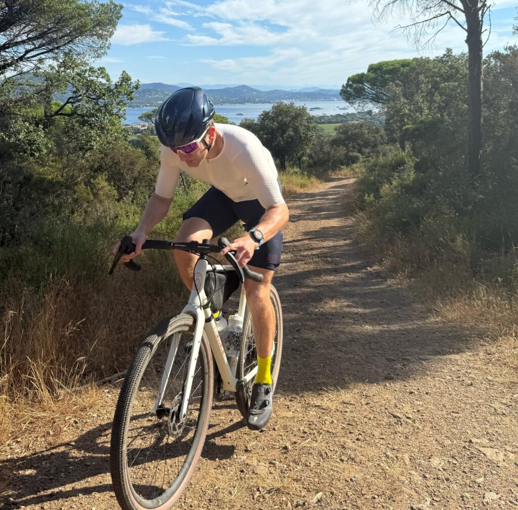 Cyclist navigating a dirt path with scenery.